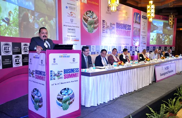 Dr. Jitendra Singh speaking at a lectern at the Northeast Business Summit