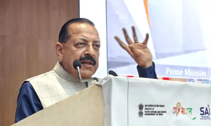 Dr. Jitendra Singh speaking at a lectern with a raised hand; the banner carries Ministry of Youth Affairs and Sports branding