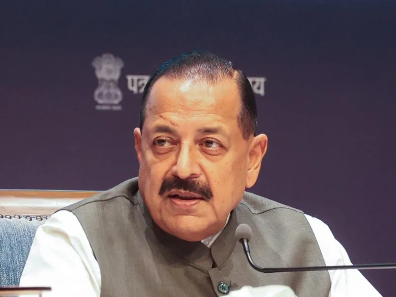 Close view of Dr. Jitendra Singh speaking into a microphone at a press briefing